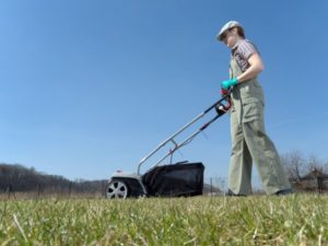Is Your Commercial Property Ready for Spring?: An image of a man dethatching a lawn.