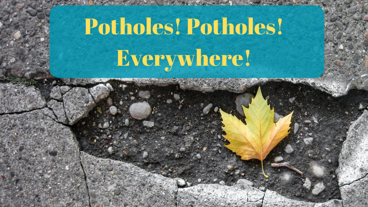 A photograph of a pothole with a leaf in it and the text: Potholes! Potholes! Everywhere!
