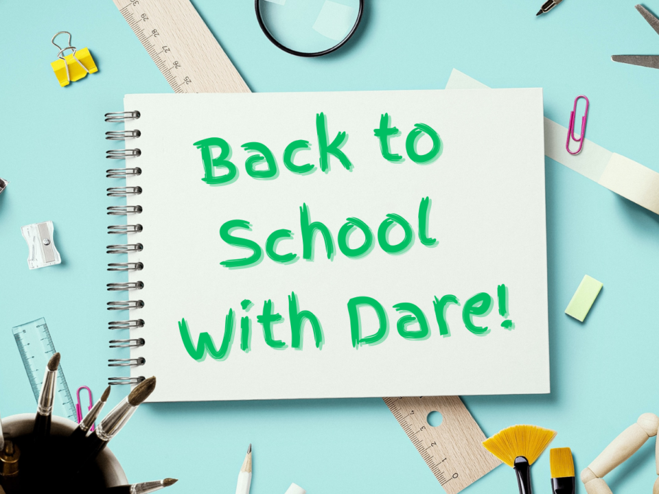 An image of school supplies with a notebook that reads, "Back to School with Dare."